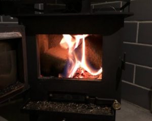 skoolie cubic mini wood stove heating