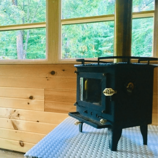 tiled skoolie wood stove area design