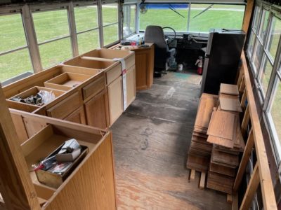 on the right you can see the wood flooring we purchased for the whole bus flooring.