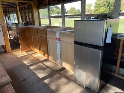 this is the refrigerator  and cabinetry we bought. on the far right side you can see the horse tank tub we purchased for the bathroom